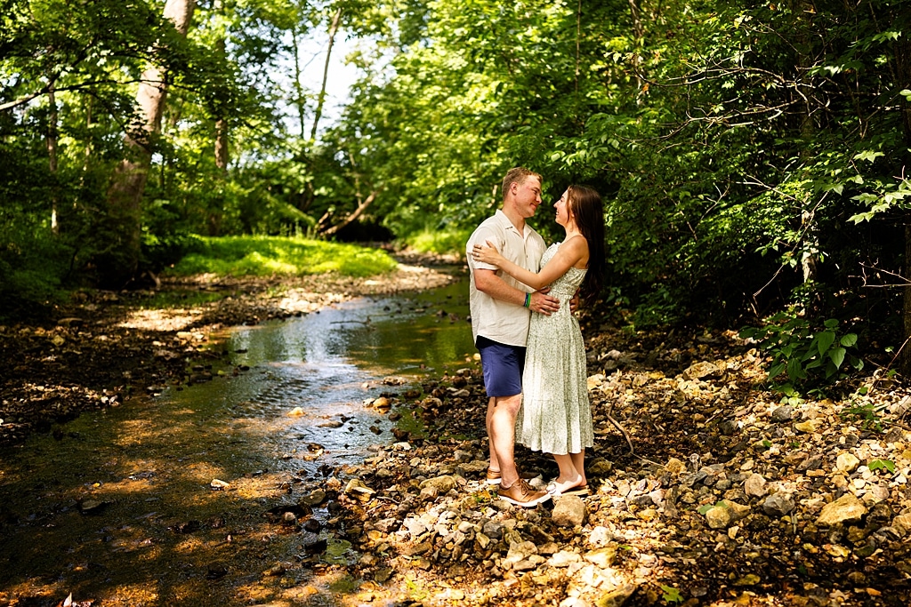Groom to be proposing during surprise wedding proposal at family home | Emotional reaction during surprise wedding proposal at family home in Missouri | Couple celebrating after surprise wedding proposal at family home | Portraits of newly engaged couple after surprise wedding proposal